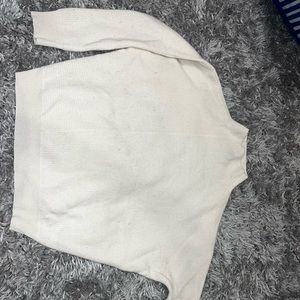 Cream cashmere turtle neck.